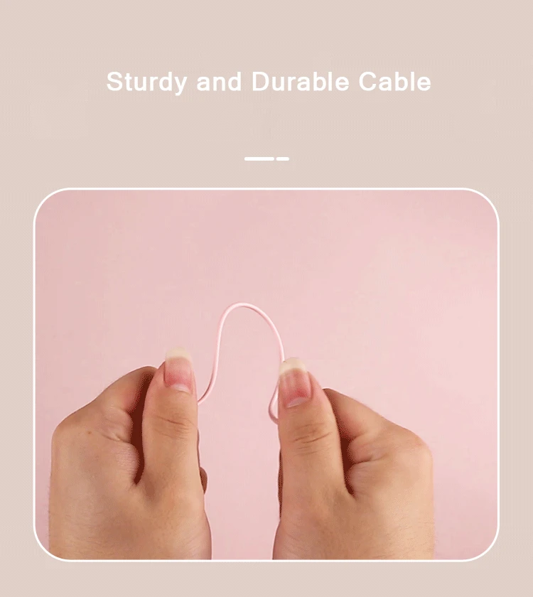 A durability test of the pink charging cable, emphasizing the sturdy, high-quality materials used for the device’s power supply.
