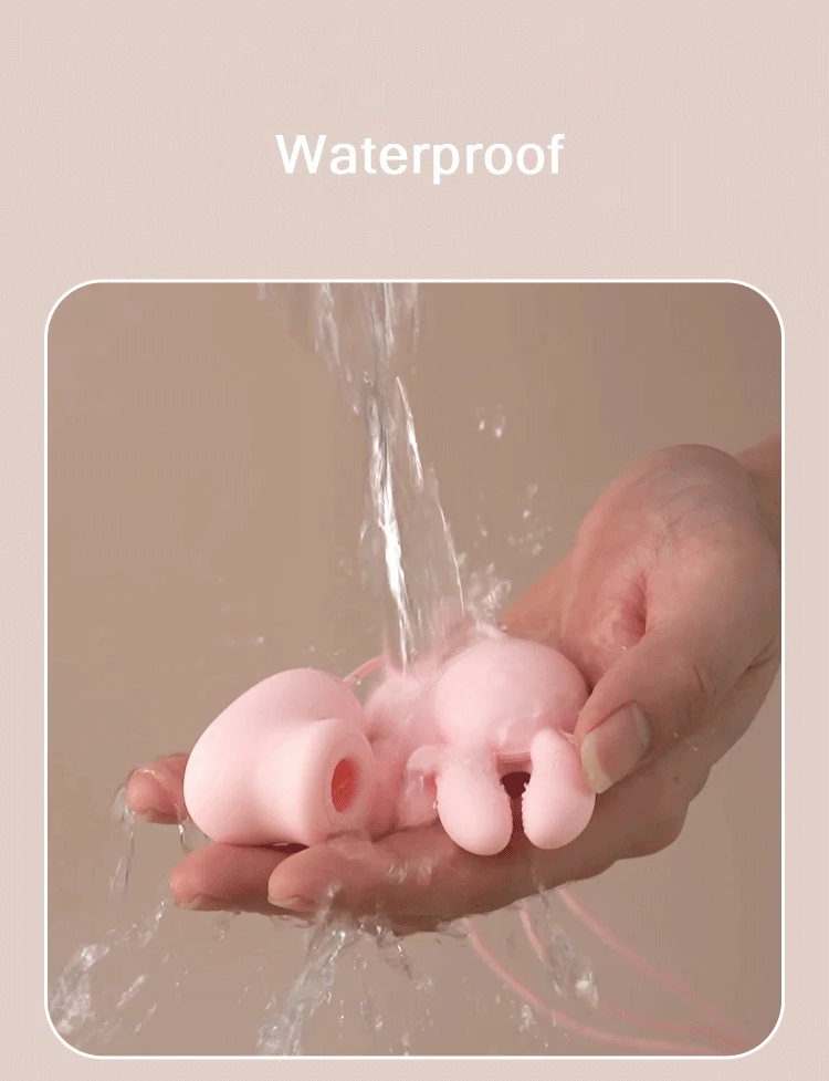 Fully waterproof adult toy being rinsed under running water, demonstrating the easy-to-clean medical-grade silicone surface of the Deer Clamp.