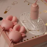 The HH Deer vibrating set showcased with its transparent suction cup base and textured internal stimulator inside a premium gift box.