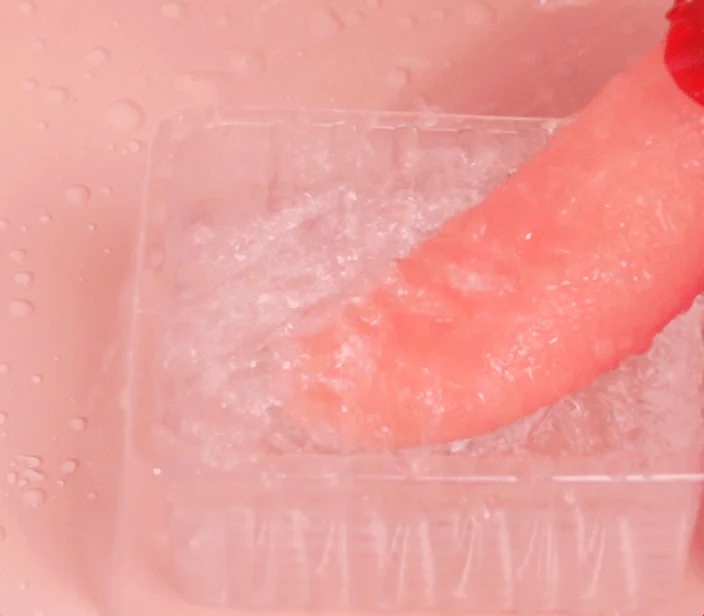 Waterproof licking vibrator submerged in water, proving the IPX7 rating for easy cleaning and adventurous shower or bath use.