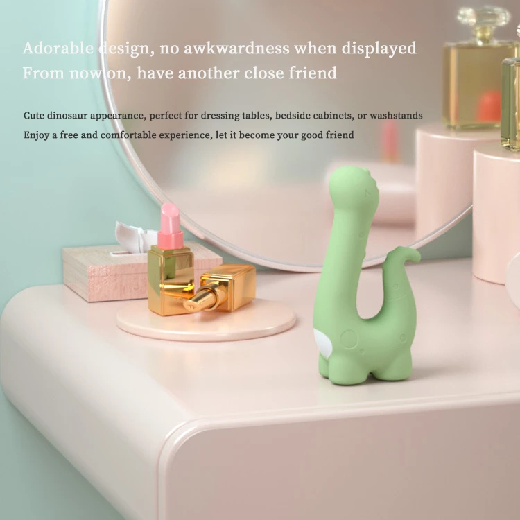 Discreet lifestyle shot of the cute dinosaur-shaped massager displayed on a vanity table next to cosmetics to show its decorative, non-awkward design.