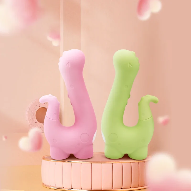 HH Little Dino adult toys displayed in Medium Pink and Grass Green colors on a decorative podium.