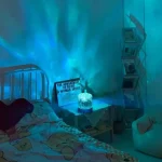 Romantic bedroom setup featuring a blue ocean ripple projection on the wall for a relaxing atmosphere.