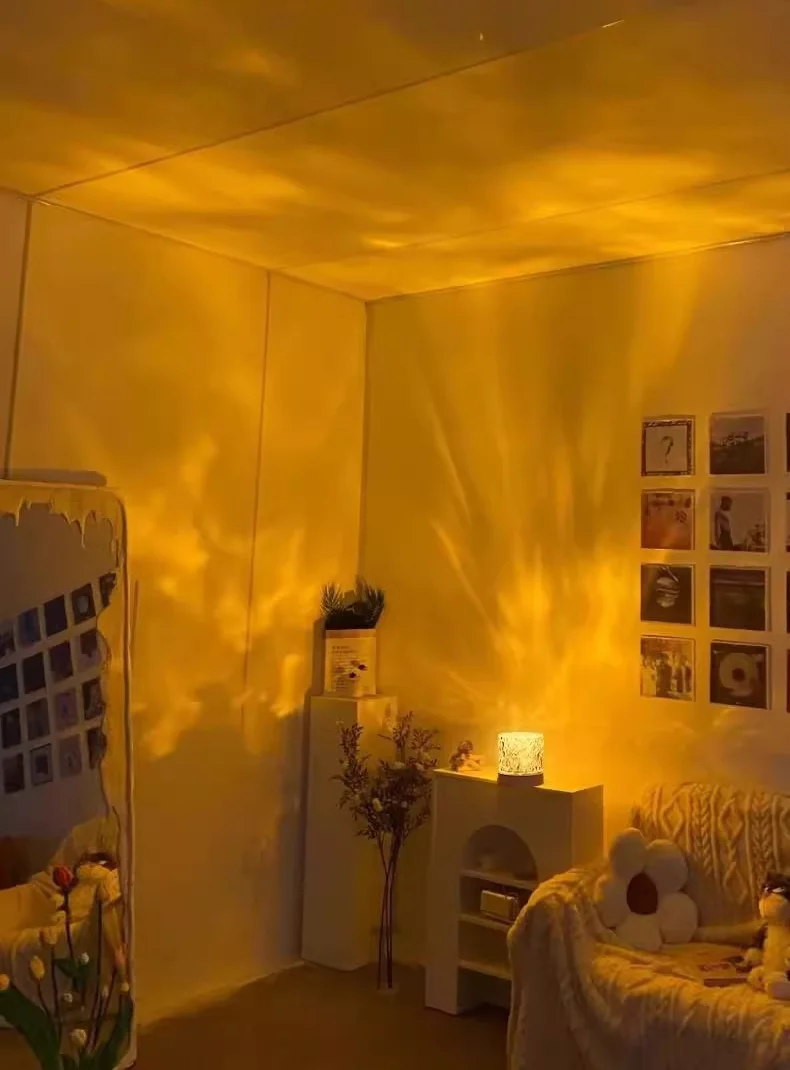 Cozy living room corner decorated with a warm yellow sunset ripple projector lamp.