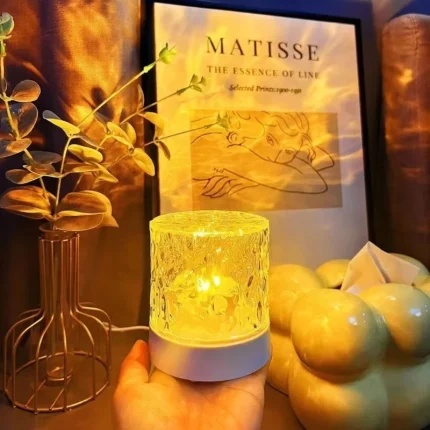 Handheld view of the compact rechargeable crystal night light with intricate texture.