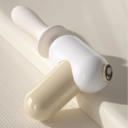 Close-up of the detachable head and LCD interface of the mini massage tool.