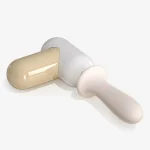 Sleek white and gold handheld personal relaxation device on a plain background.