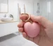 HooHss pink heart vibrator holding in hand