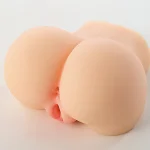 Angled view of dual-channel realistic butt stroker with compact size and rounded curves