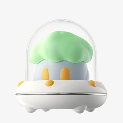 Main product view of the Astroshroom green edition, a discreet dual-function vibrator and suction device in a UFO-style case.