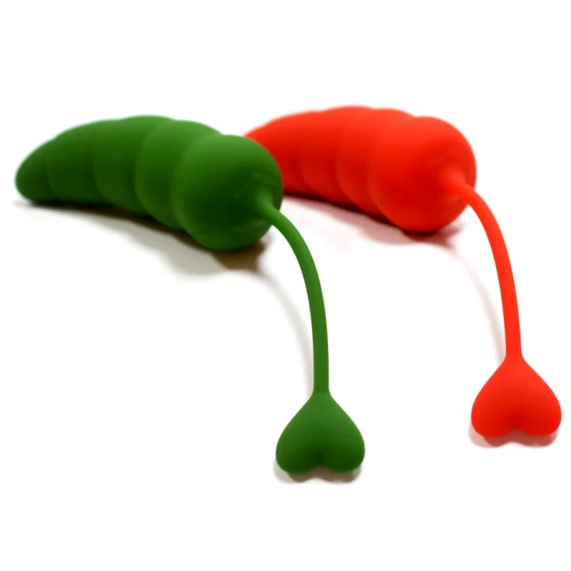 Rear view of two pepper-themed intimacy devices showing the flexible heart-shaped retrieval tail for safe and easy use.