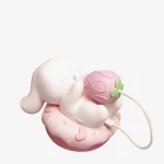 The Bubuko Bunny clitoral suction device featuring a soft-touch silicone finish and a detachable strawberry-themed vibrating attachment on a decorative cake base.