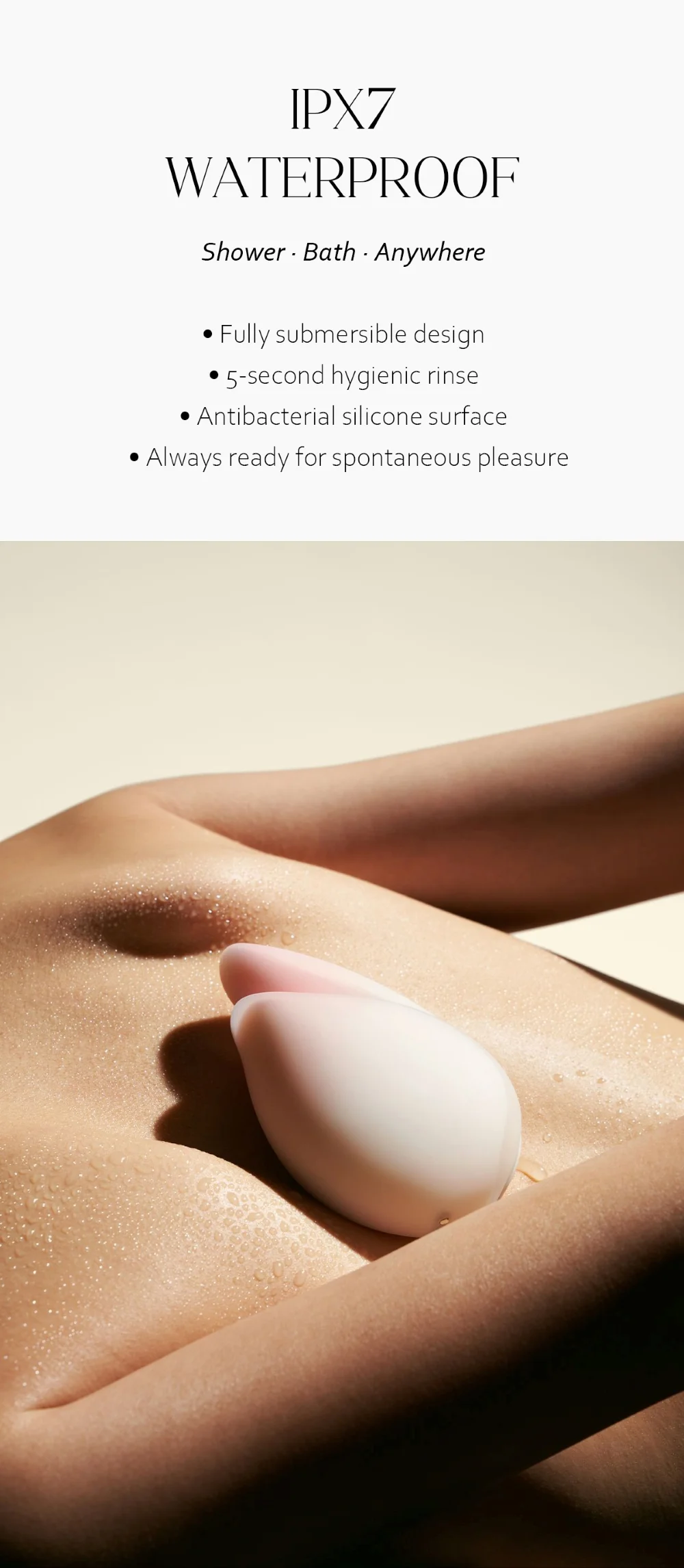 Water-droplet covered Budding Moon massager showcasing the IPX7 waterproof rating, perfect for use in the shower or bath.