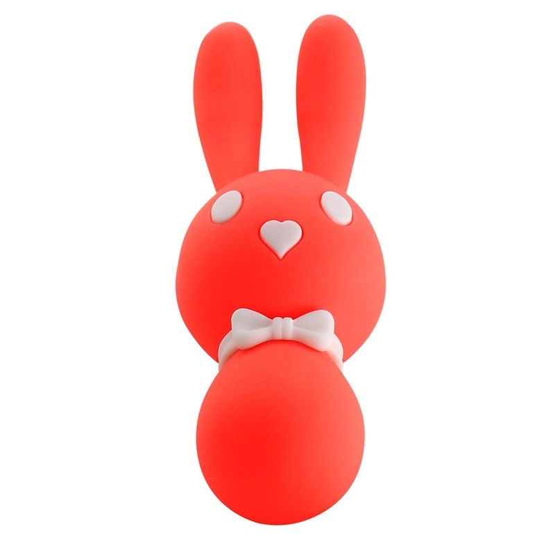 Front view of the Dorcel Triple Motors Lovely Bunny in vibrant coral, highlighting the cute rabbit ears and heart-shaped nose on the clitoral stimulator.