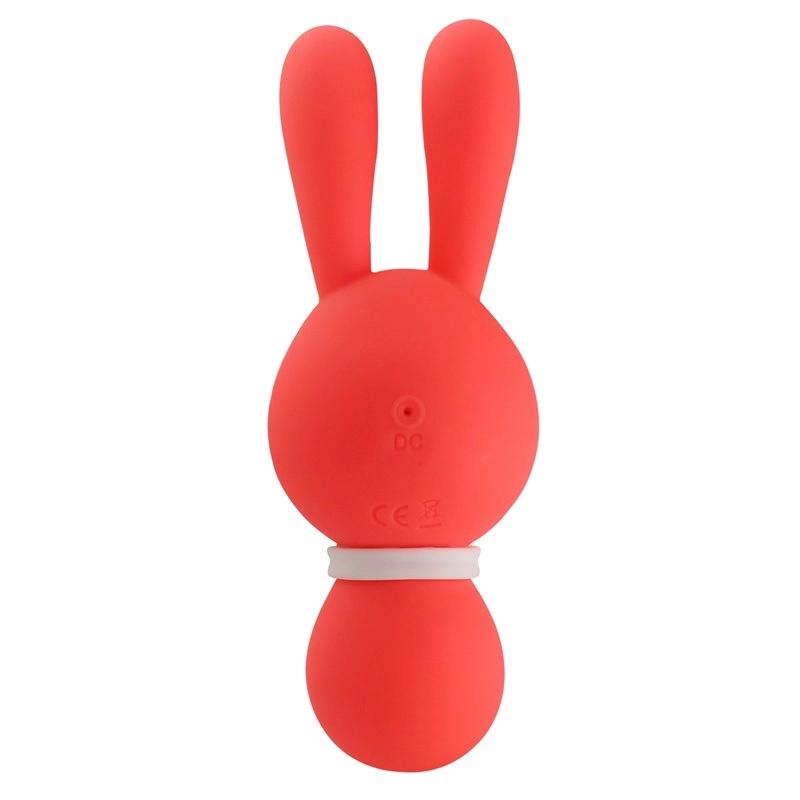 Back view of the coral rabbit vibrator showing the DC charging port and discreet CE safety markings on the high-quality body-safe silicone.