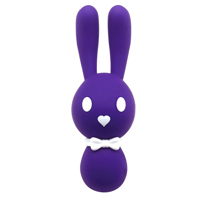 Full frontal shot of the deep purple Lovely Bunny by Dorcel, a stylish and discreet clitoral and internal massage wand with a decorative white bow.