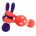 Two colorful rabbit-shaped clitoral vibrators in deep purple and vibrant coral leaning against each other to showcase the variety of available shades.