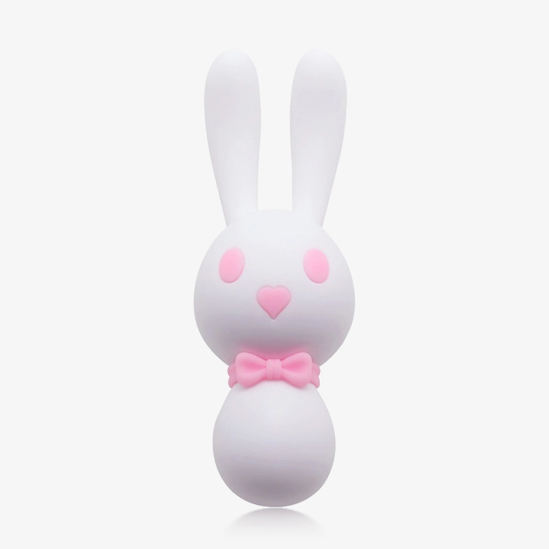 hh-bunny-dorcel-24 Front view of the white Dorcel bunny vibrator highlighting its adorable aesthetic, featuring pink heart-shaped eyes and a charming bow tie detail at the neck.