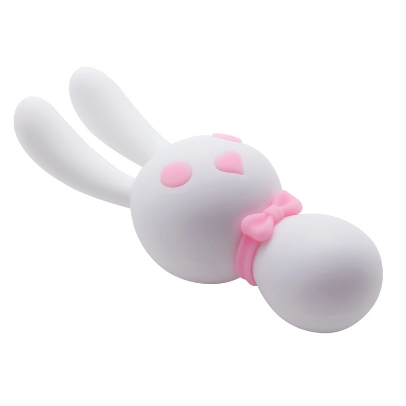 Angled close-up of the white silicone intimacy tool showing the smooth, body-safe texture and the ergonomic dual-ball design for targeted stimulation.