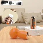 Portable intimacy device being charged via a power bank and wall outlet, highlighting its travel-friendly design.