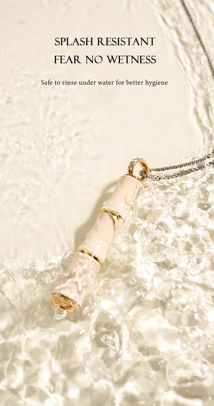 Splash-resistant intimacy device being rinsed under water to demonstrate its easy-to-clean design.