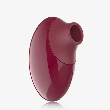 Sleek side profile of a compact wine red clitoral stimulator featuring a smooth, ergonomic shape for comfortable hand-held use.