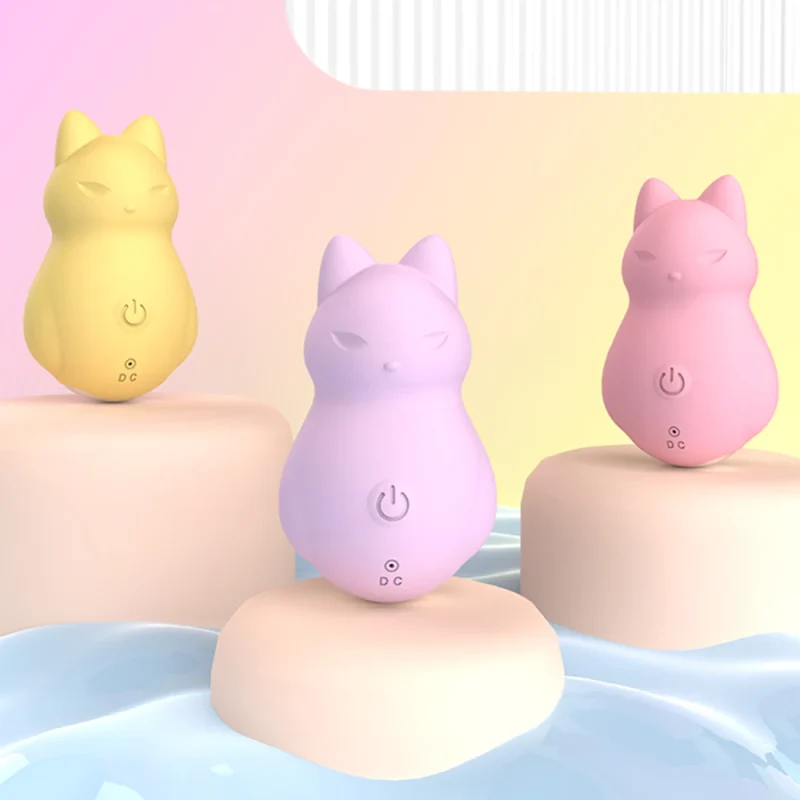 Collection of miniature fox-shaped pleasure toys in pastel yellow, purple, and pink displayed on modern aesthetic pedestals.
