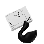 Midnight black edition of the Cygnus suction toy paired with its sleek, discreet branded box.