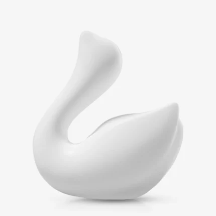 Side profile of the white Cygnus pleasure device showcasing the seamless, ergonomic body designed for external massage.
