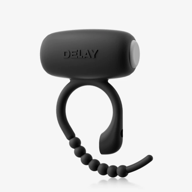 hh-disposable-energy-cock-ring-gallery-6 Product studio shot of the sleek black stamina-enhancing ring featuring a beaded adjustable strap and ergonomic "DELAY" embossed casing.