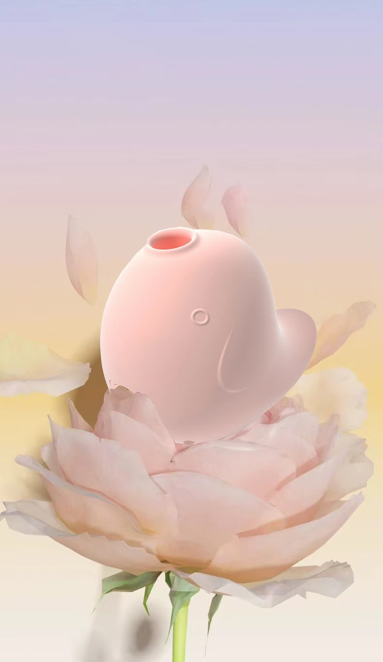 Close-up of the pink Dudu Bird air-pulse stimulator nestled within rose petals, highlighting the gentle, skin-friendly surface and its role in self-care and relaxation.
