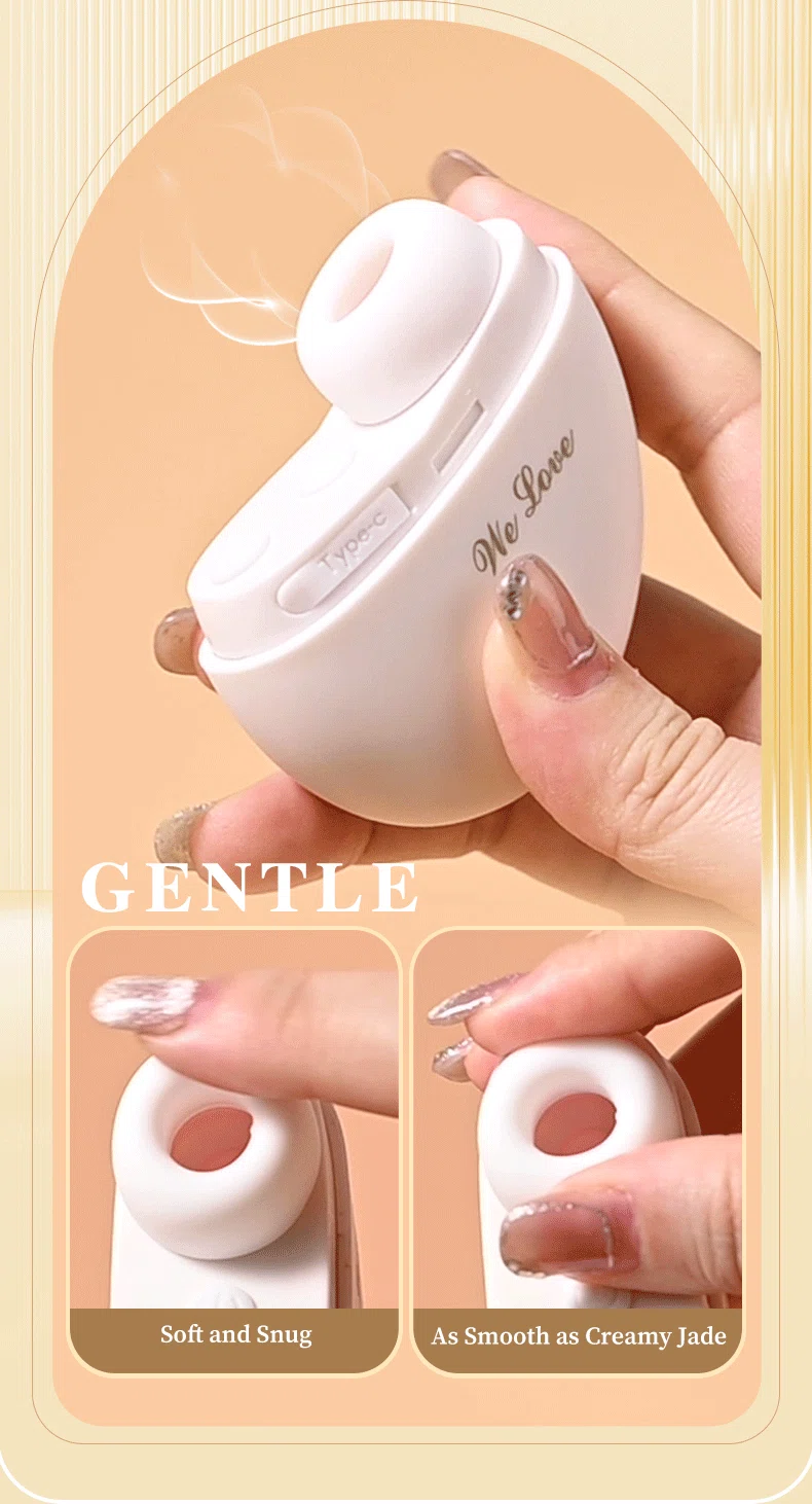 Handheld shot of the Empress white vibrator showcasing the Type-C charging port and the "creamy jade" smoothness of the silicone tip.