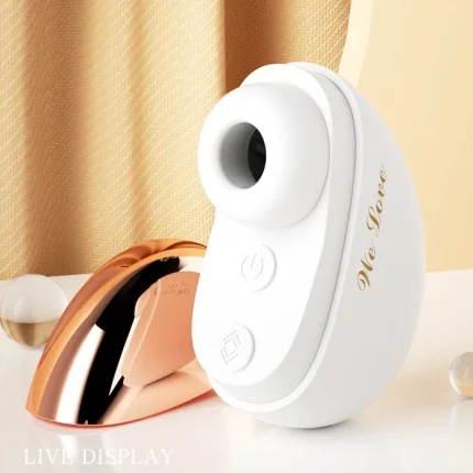 Live display of the HH Empress Powder Puff, a white clitoral air-suction stimulator with a rose gold dustproof cover on a sleek vanity.