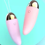 Top-down aesthetic view of the lavender and rose pink intimacy tools featuring gold-plated accents and pull strings.