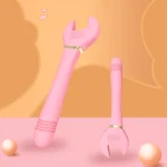Two pink HH-FlexWrench intimacy devices shown in different orientations to highlight the curved handle and dual-tip stimulation head.
