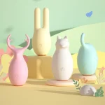 A collection of the HH Forest Elf vibrator set featuring four animal-themed clitoral stimulators in soft pastel colors including pink deer, yellow rabbit, white fox, and mint elephant designs.