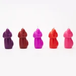 Side profile view of a collection of colorful wax play candles in a minimalist fox silhouette design.