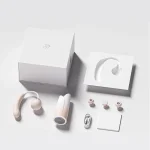 Luxury adult pleasure device unboxing set featuring the Rose-inspired clitoral stimulator, charging base, and discreet white gift box.