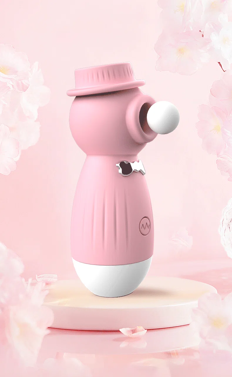 Artistic shot of the pink HH Gentleman clitoral stimulator surrounded by cherry blossoms, illustrating its gentle yet powerful "kissing" function.