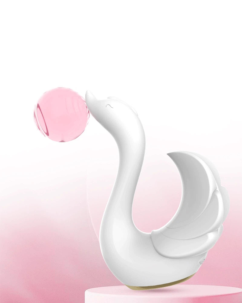 Elegant white swan-themed vibrator resting on a podium, showcasing its artistic aesthetic and premium body-safe silicone finish.