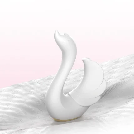 Lightweight and travel-friendly swan pleasure tool resting on a textured surface, highlighting its versatile portability.