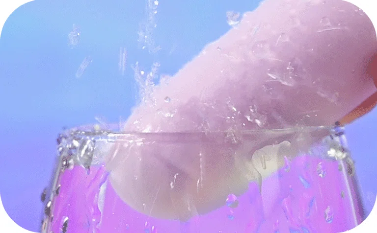 Action shot showing the HH Gummy Bullet being submerged in water to demonstrate its fully waterproof IPX7 rating for bath and shower play.