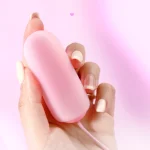 Handheld scale reference for the HH Gummy Bullet showing its compact, travel-friendly size and discreet palm-sized design.