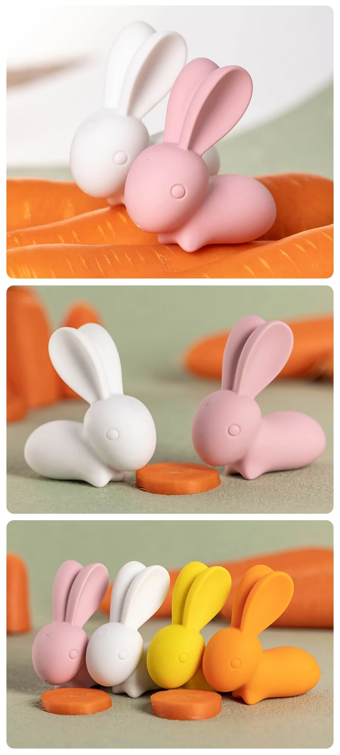 Product variety shot showcasing the HH Happy Bunny collection in white, pink, yellow, and orange arranged with carrot props to emphasize the playful design.