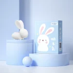 A minimalist white rabbit intimacy massager showcased on a blue tiered display stand with its professional Lesparty branded box, highlighting the sleek design and premium presentation.