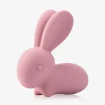 Detailed close-up of the premium, skin-safe silicone texture and the discreet integrated power button on the bunny-themed massage wand.