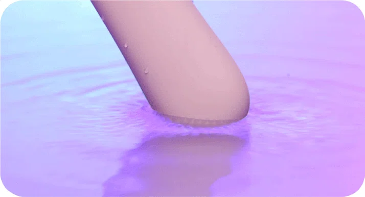 A waterproof vibrator submerged in water, showcasing the fully sealed design suitable for bath or shower use and easy cleaning.