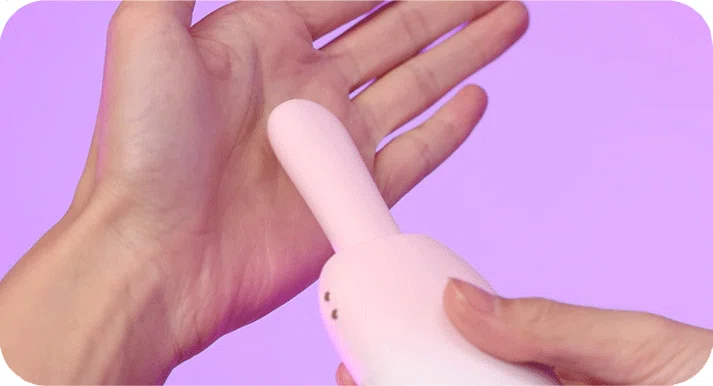 Handheld view of the ice pop style intimacy tool demonstrating its compact, travel-friendly size and discreet aesthetic for personal wellness.