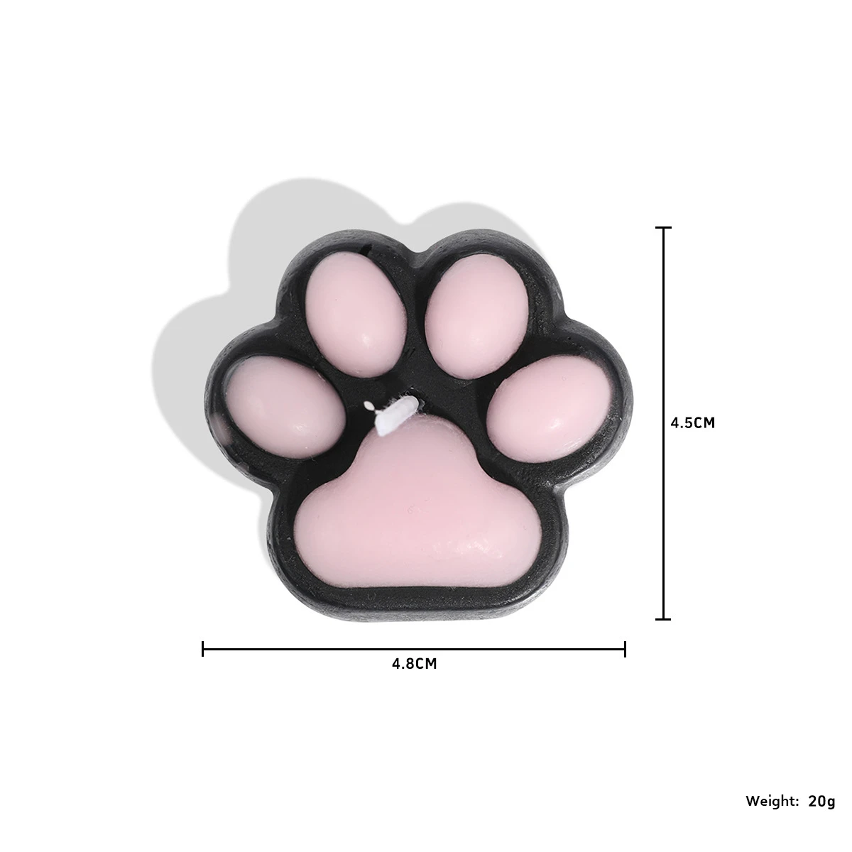 Close-up of a pink and black paw-shaped wax candle, weighing 20g and measuring 4.8cm, designed for creating an atmospheric ambiance during intimate moments.