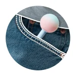 Discreet adult toy shown tucked into a denim jeans pocket to illustrate its portable, travel-friendly, and compact size.